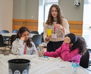 Middle school girls working on STEM experiments 