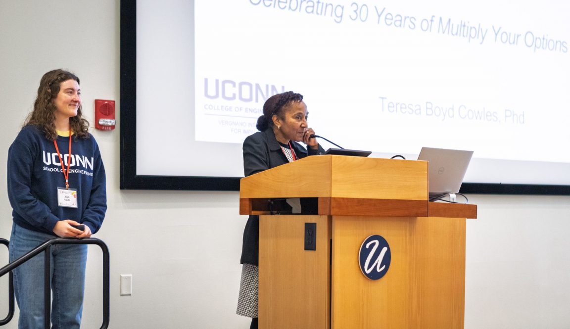 Two women presenting at a podium.