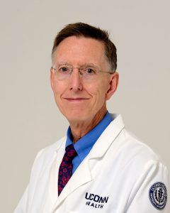 Dr. Robert Dowsett studio portrait white coat