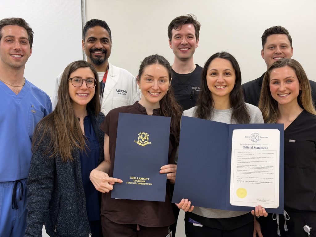dentists pose with proclamation