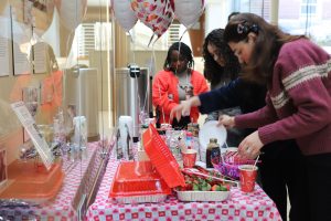 UConn Nursing students at a cacao and dark chocolate booth.