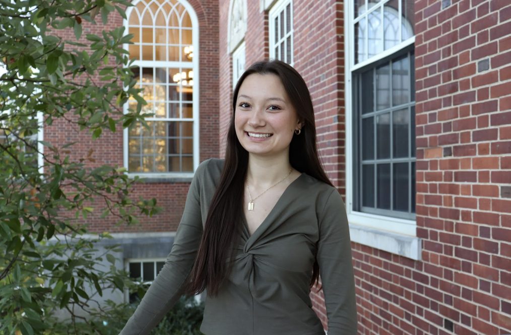 Hailey DeWalt outside a brick UConn building