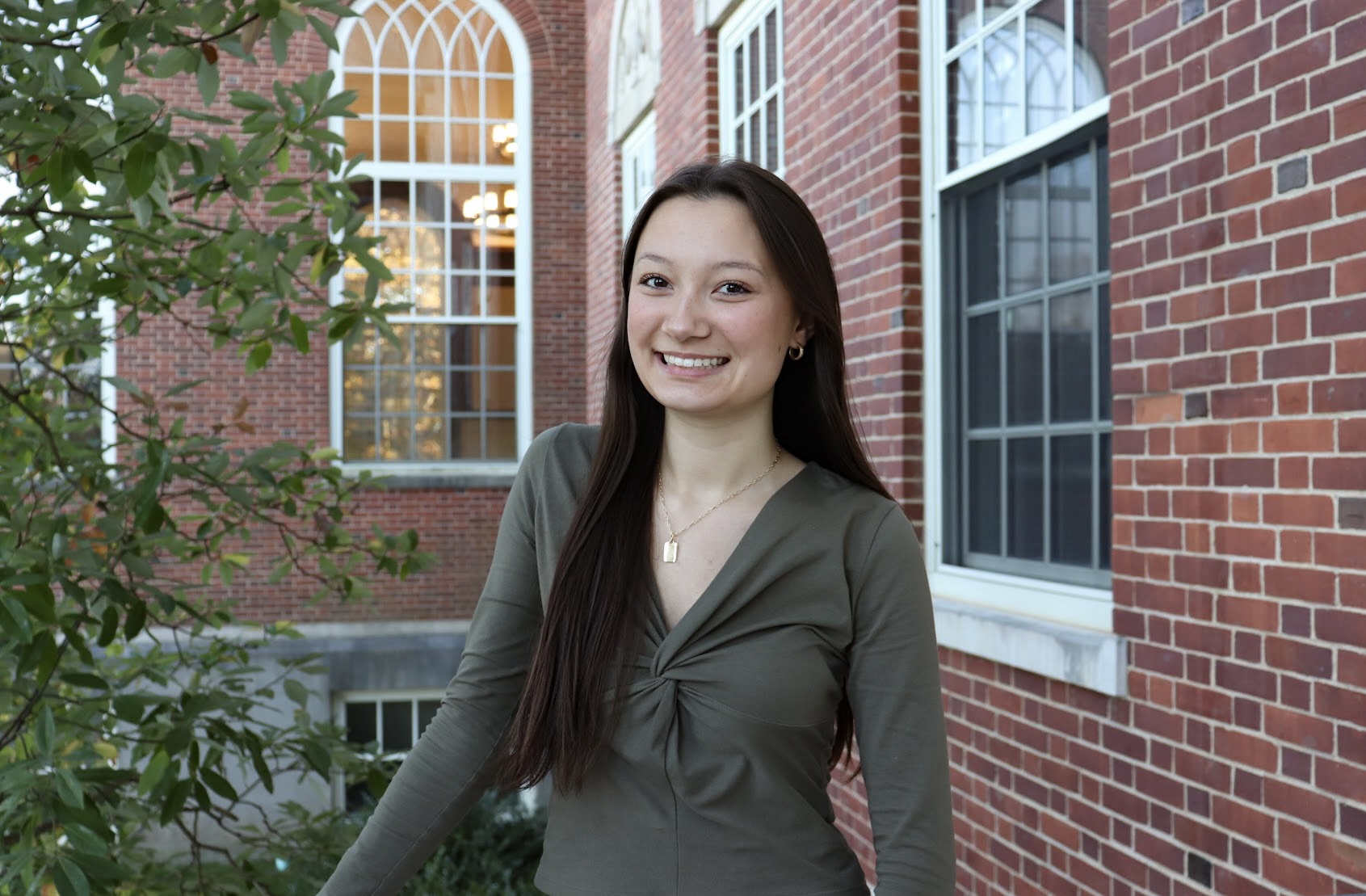 Hailey DeWalt outside a brick UConn building