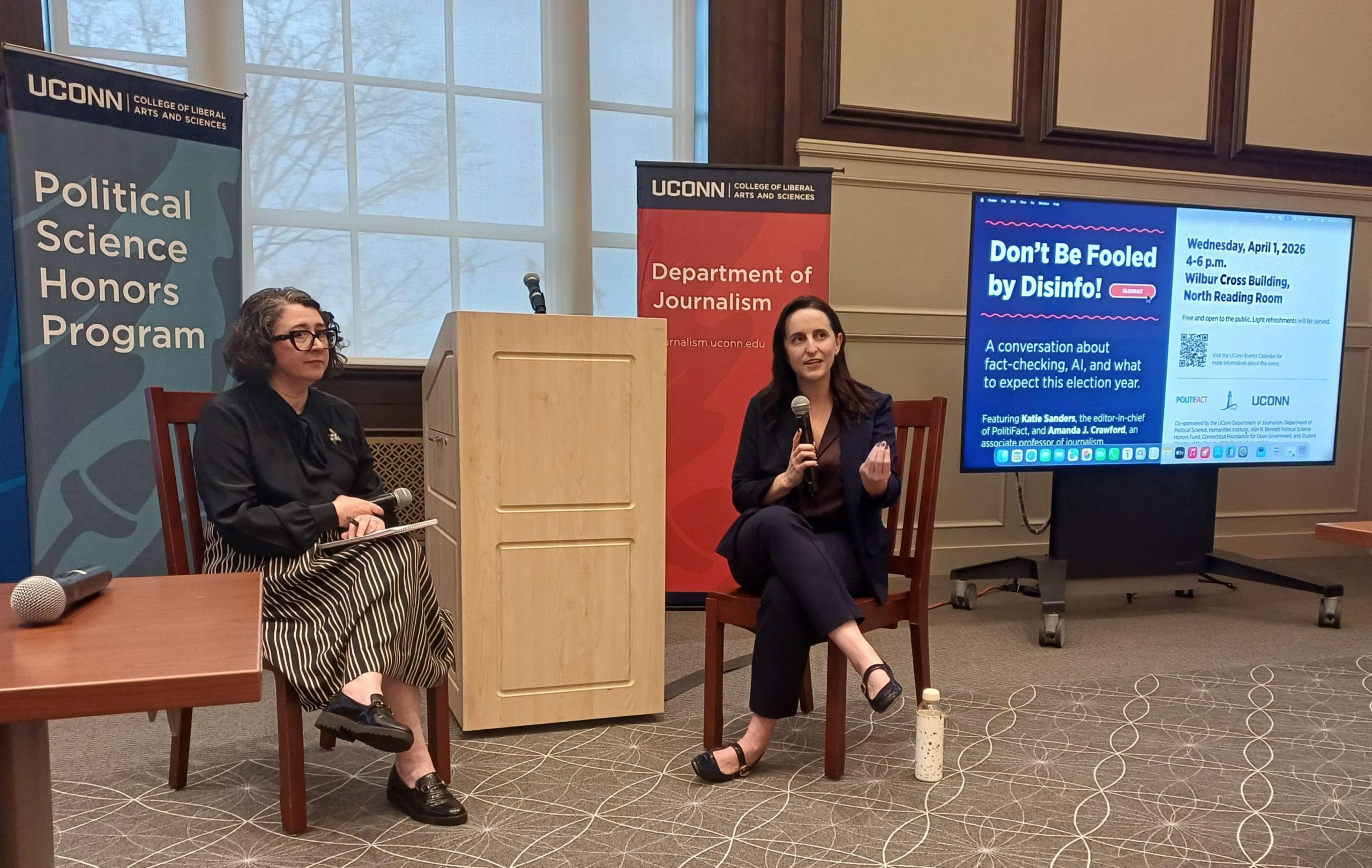 Amanda Crawford, left, and Katie Sanders, right, address an audience at UConn.