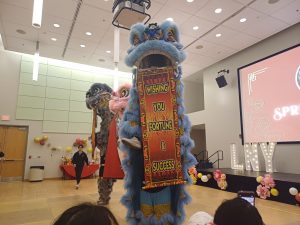 Dancers costumed in the style of the Chinese lion dance. 