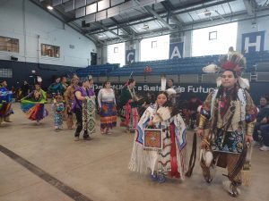 People dressed in traditional Native American regalia