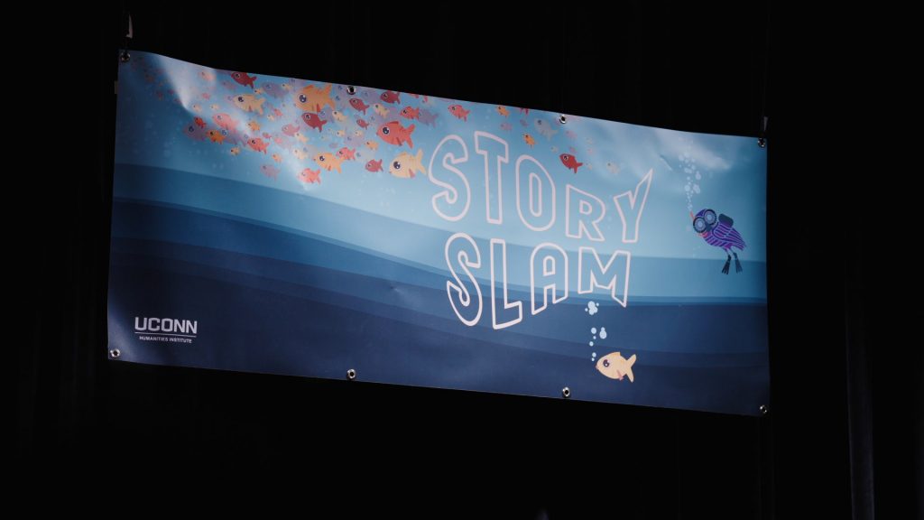 A banner with the words "UConn Story Slam"