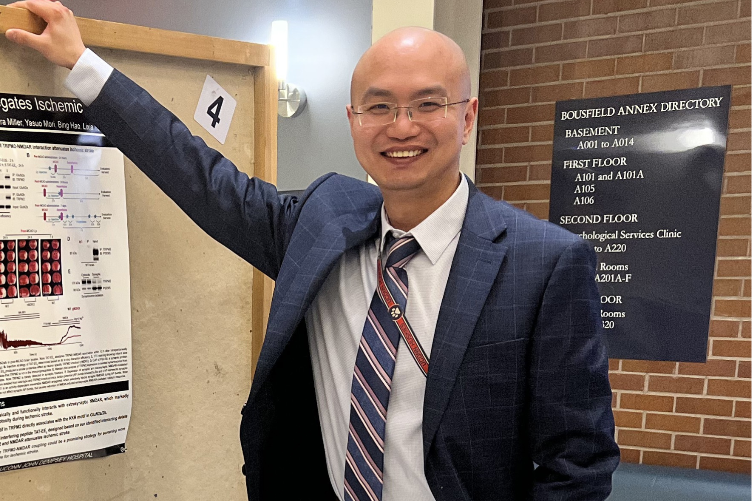 Post-doc Dr. Pengyu Zong with poster