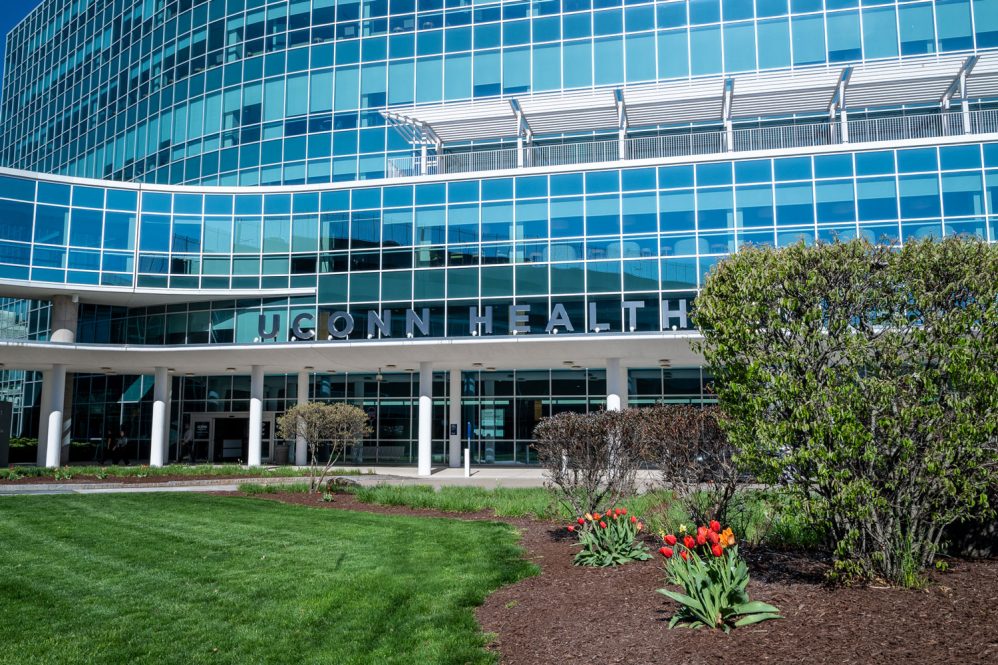 lawn in front of Outpatient Pavilion in early spring, includes rich green lawn and tulips