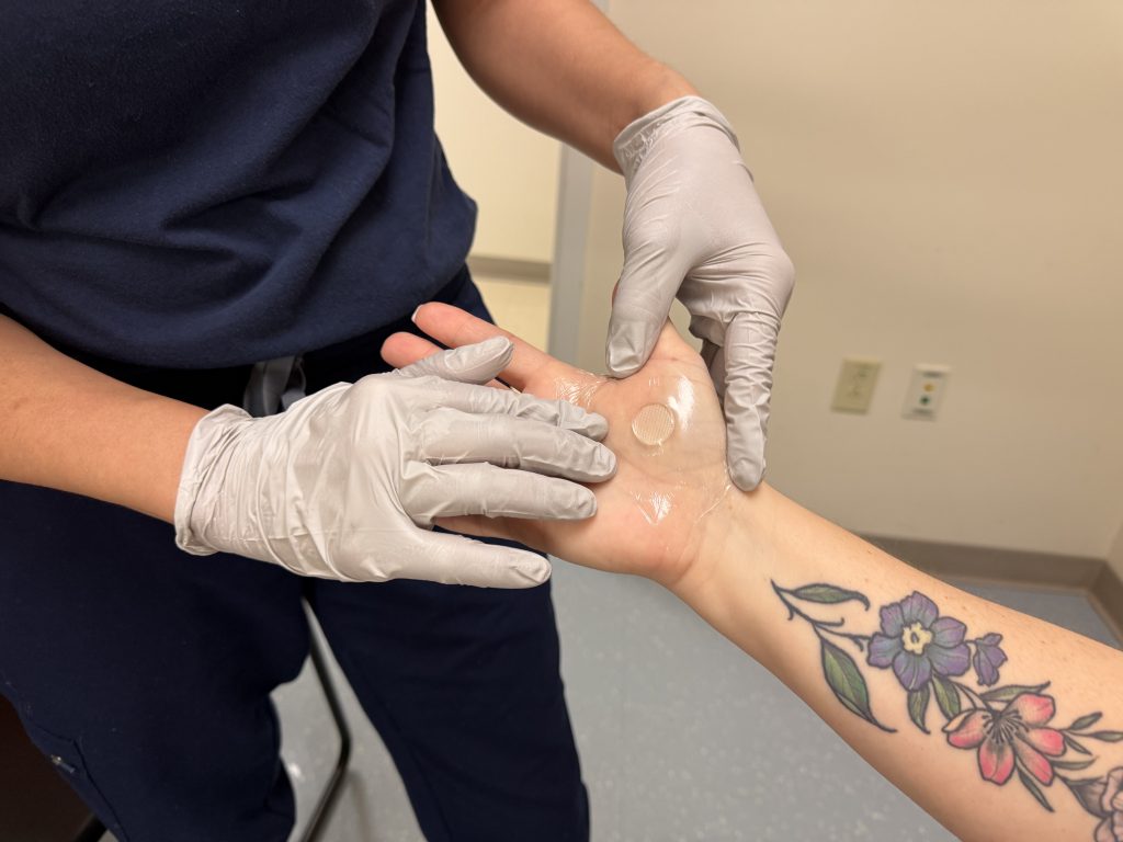 The new skin patch has tiny projections on it that gently access the deeper, upper layers of the skin to capture immune cell samples without any bleeding or pain (UConn Photo/Lauren Woods).