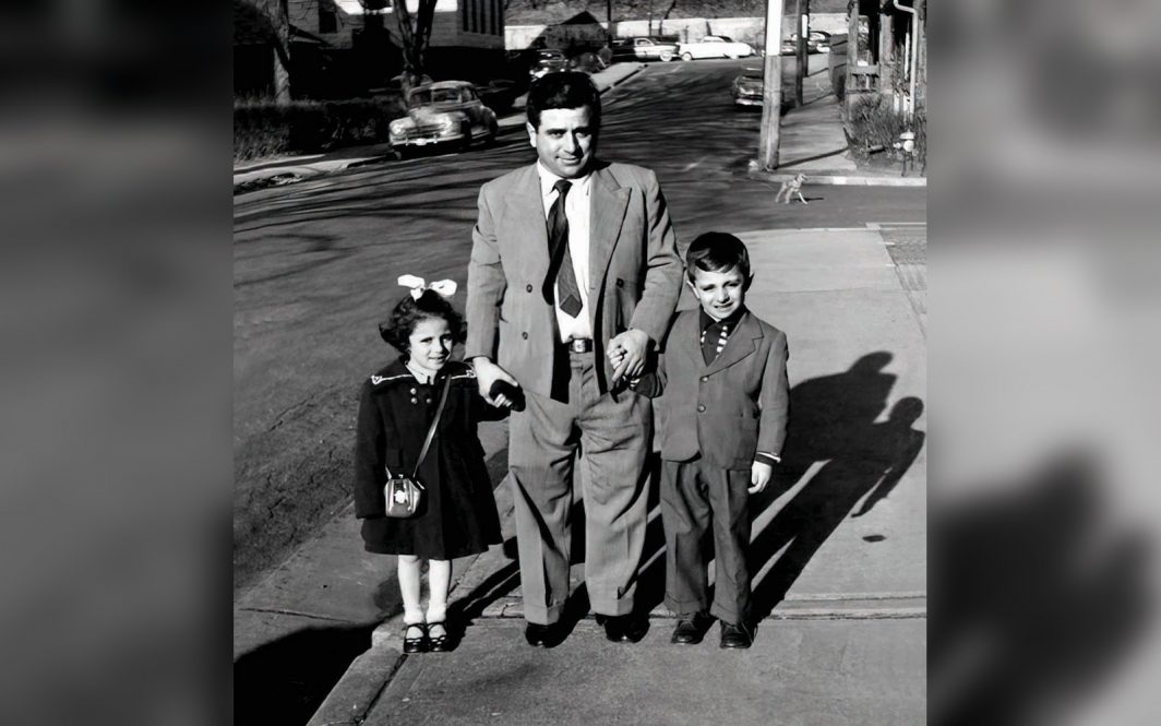 UConn alumna Toni (Iannuzzi) Boucher stands with her father and brother in this family photo.