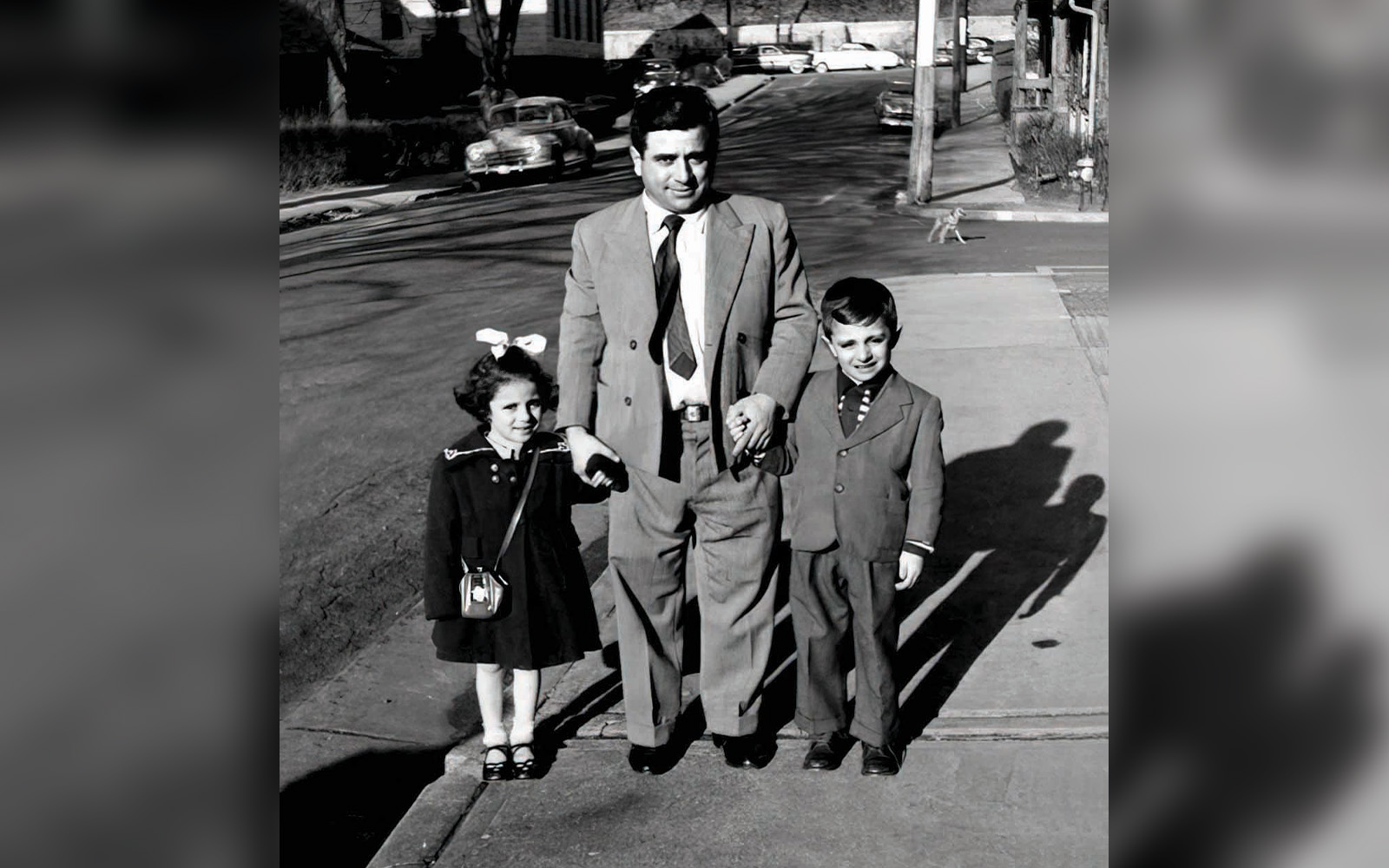UConn alumna Toni (Iannuzzi) Boucher stands with her father and brother in this family photo.
