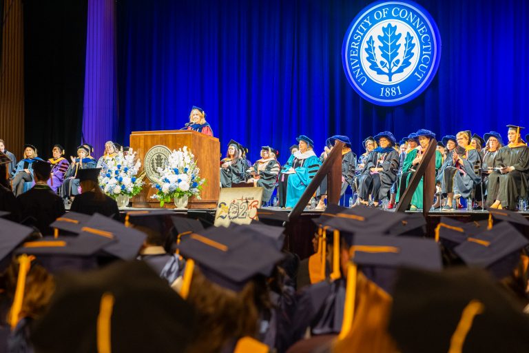 Graduates listening to Dean Dickson's speech.