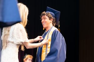 A UConn Nursing graduate getting pinned at graduation.