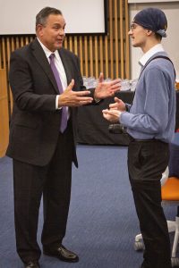 Two men chatting.