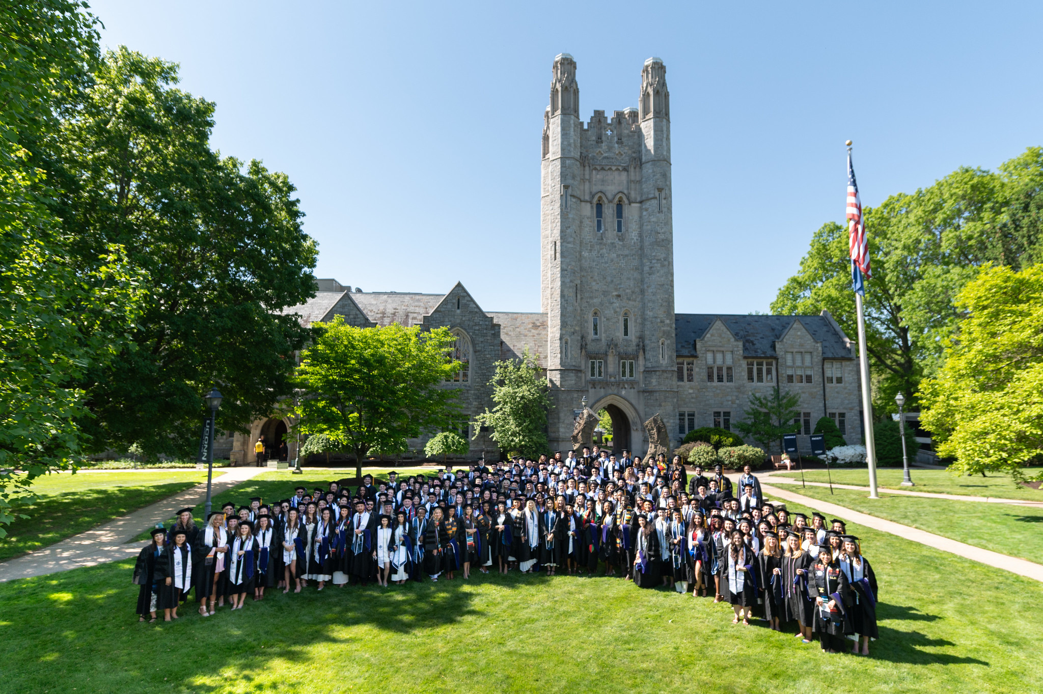 Approximately 235 graduates wearing regalia taken from above the campus.