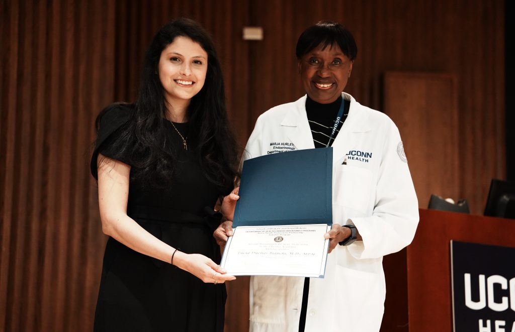Dr. Hurley honoring HCOP alum Dr. Lucia Duenas-Bianchi at Academy Closing Ceremony - May 13, 2026.