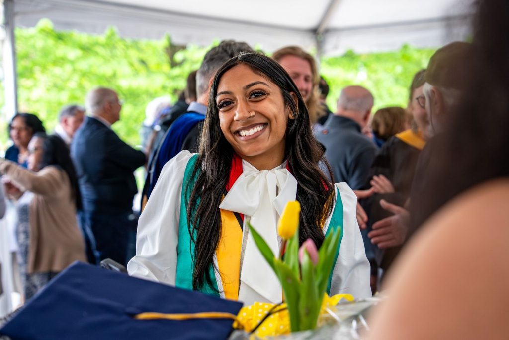 Female graduate poses before 2026 CAHNR Commencement