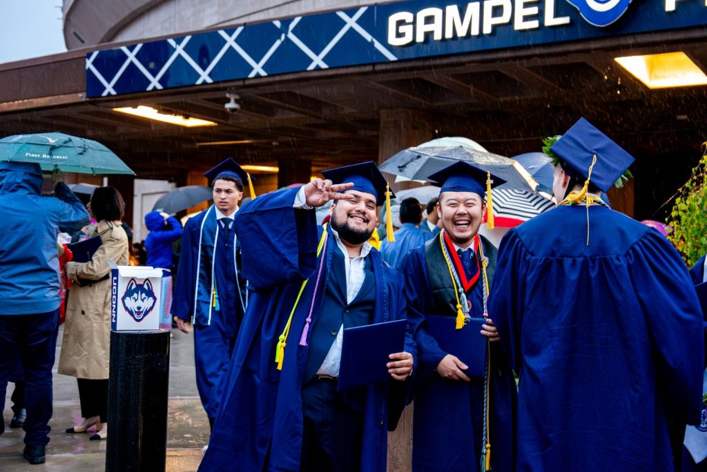 CAHNR graduate pose after commencement
