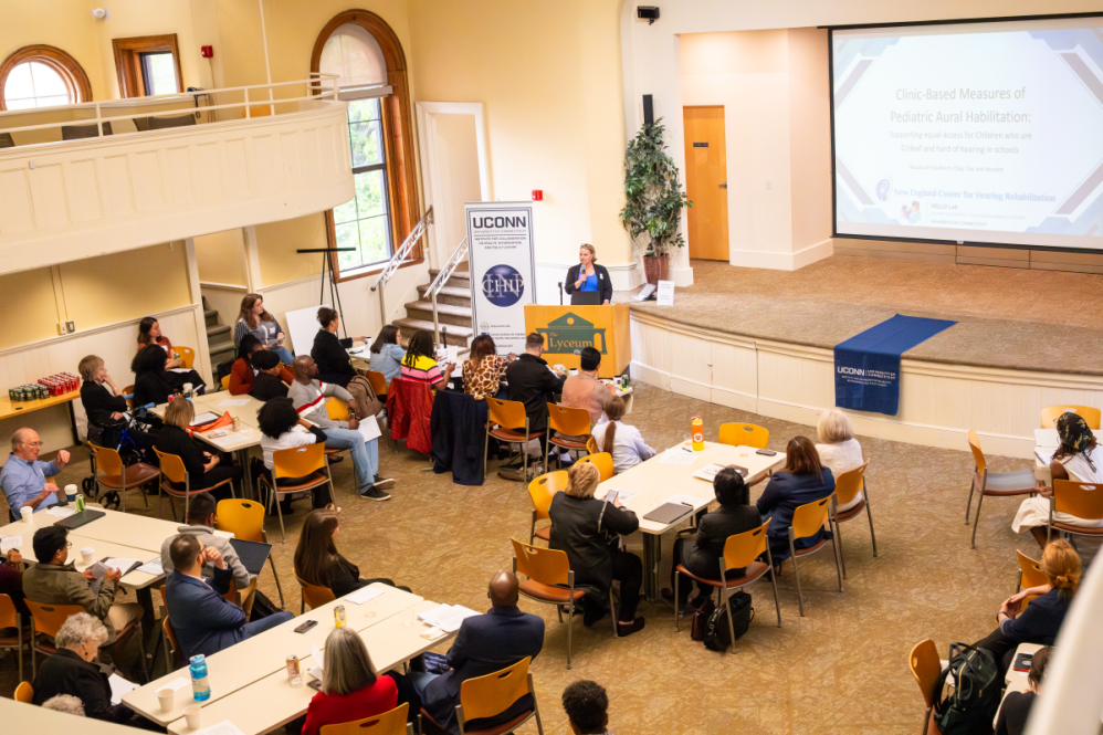 Attendees at InCHIP's Community Engaged Research Forum listen to a presentation during the event