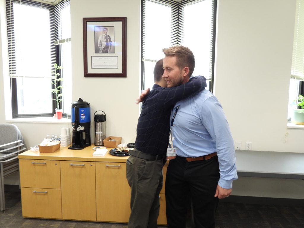 Dr. Siccardi and Steele hugging.