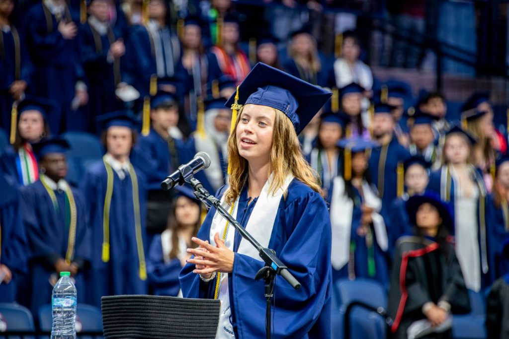 Female student sings national anthem
