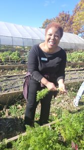 Woman in a garden smiling