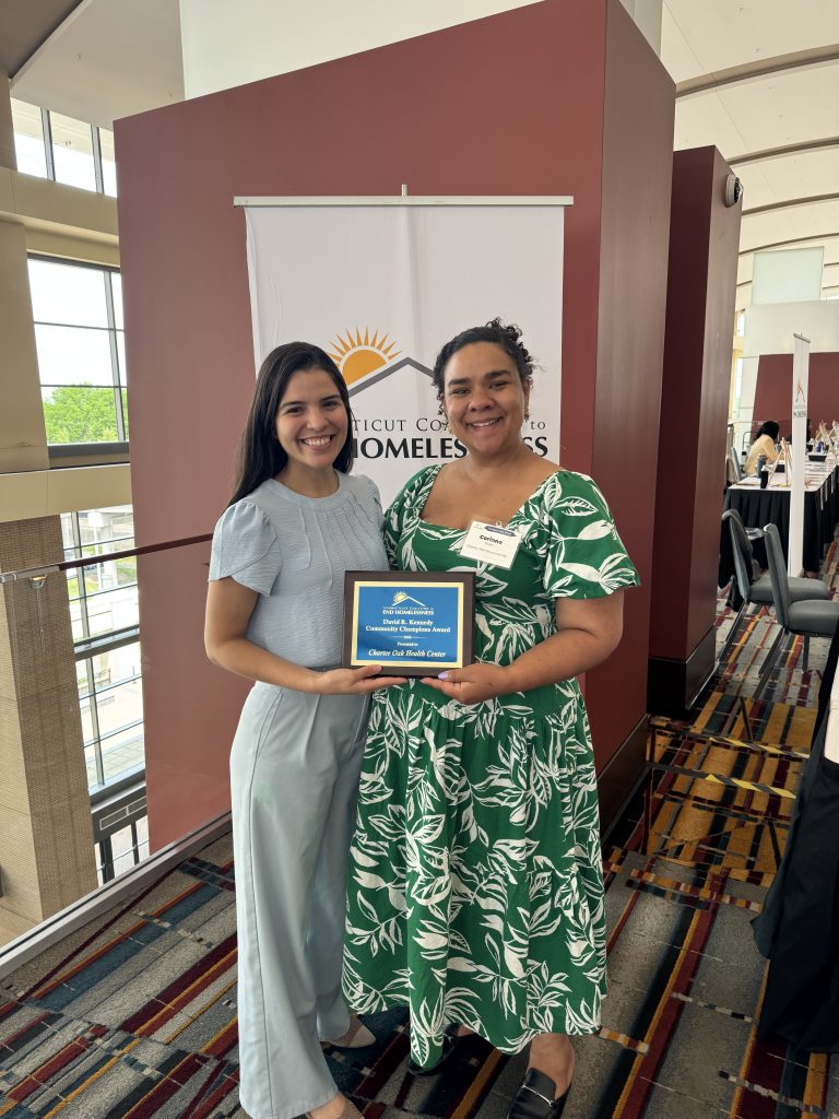 Fourth-year internal med chief resident Dr. Lara Melo Soares Pinho de Carvalho with Corinne Plaisir of Charter Oak.