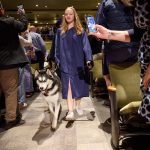 Jonathan the Husky leads graduates inside the Jorgensen Center for the Performing Arts.