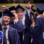Graduates inside the Jorgensen Center for the Performing Arts.
