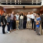 students and faculty pose for photo