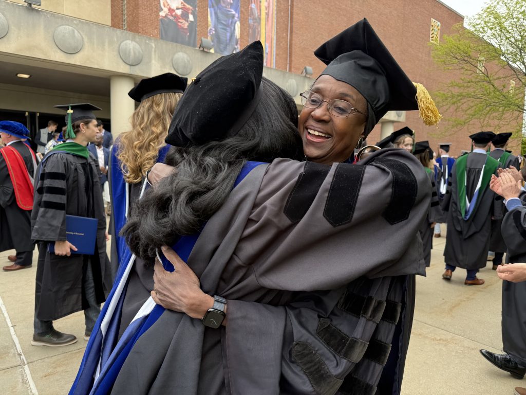 Hurley getting a hug from mentee Kai Clarke