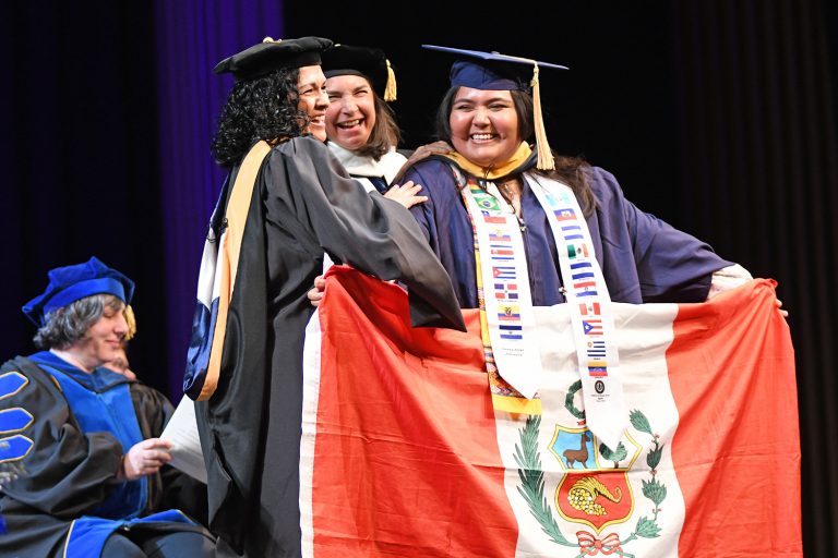 Connecticut Adelante! Scholar Maricielo Valencia Celadita '26 MSW celebrates and represents the country of Peru during the UConn School of Social Work Commencement Ceremony held May 9, 2026 at the UConn Storrs campus.