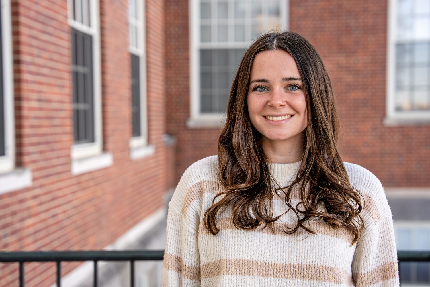 Elizabeth Tarduogno ’26 (CAHNR), a nutritional sciences student poses for a photo outside the Wilbur Cross Building (WCB)