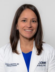 Woman wearing a white doctor coat named Jessica Abrantes-Figueiredo
