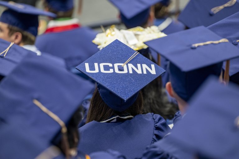 Commencement caps with one saying 