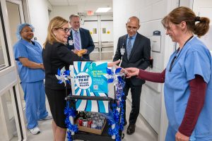 Leadership rounding in hospital area with snack cart