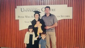 Jasna Jankovic poses with her family at her master’s graduation ceremony.