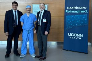 portrait of three men next Healthcare Reimagined banner