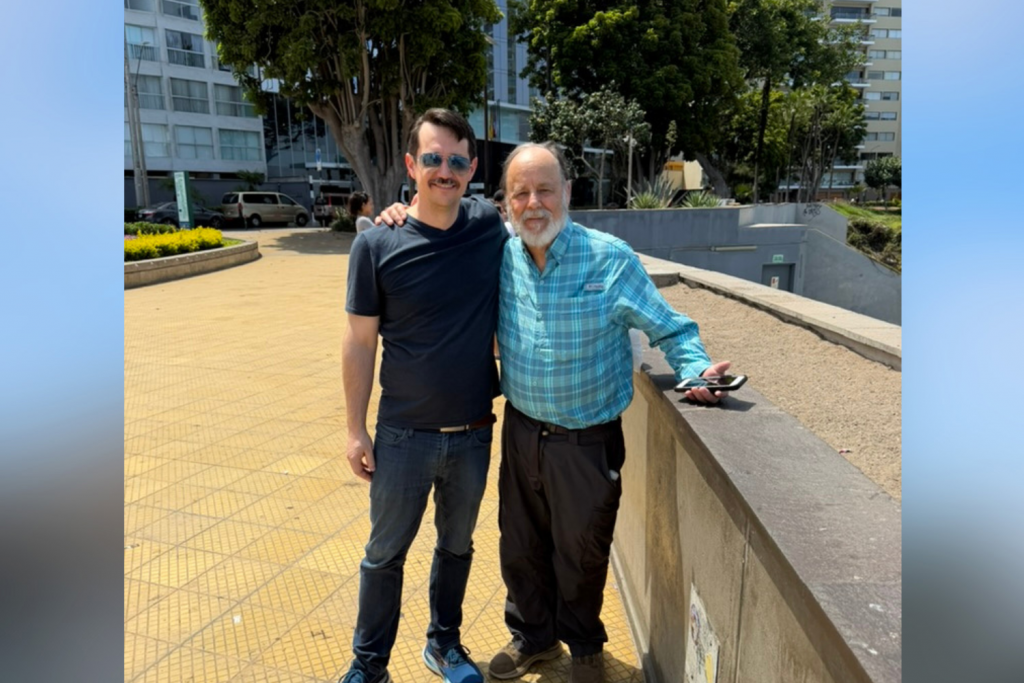 2 men posing together