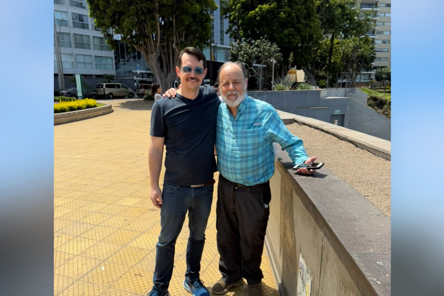 2 men posing together