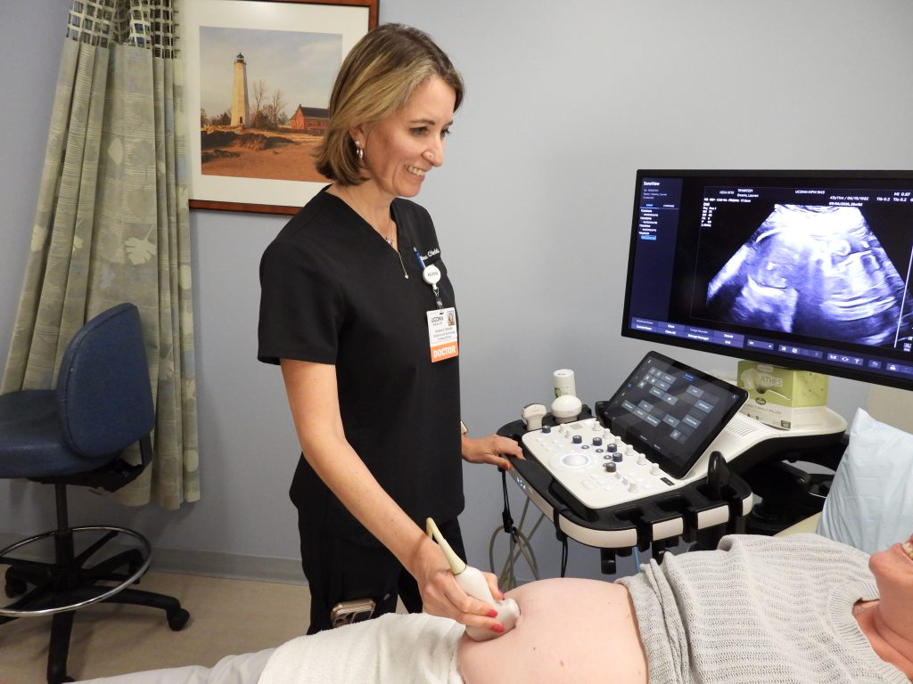 Dr. Shields caring for a pregnant patient at UConn Health's Women's Center.