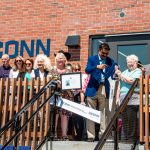 Elected officials, UConn leadership, and George Leigh Minor's family, including Minor's sister, Elizabeth Baker, cut the ribbon on the Minor Center