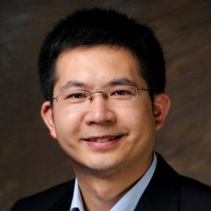 Portrait of Changchun Liu smiling in professional attire.