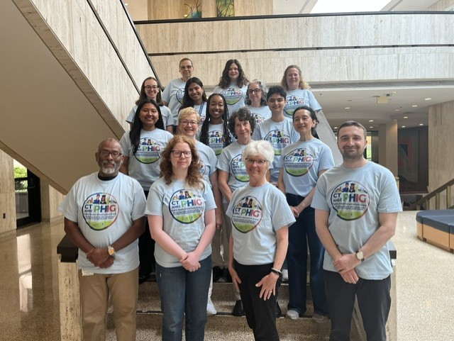 PHIG team at UConn Health in academic lobby.