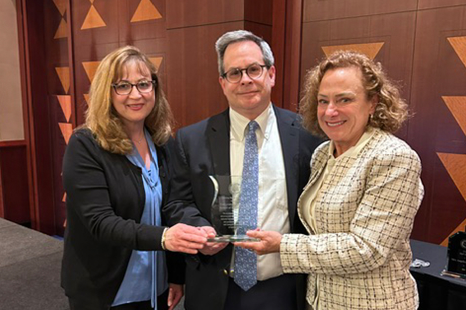 three dentists accepting award
