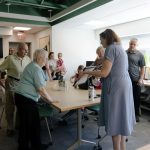 CAHNR Development Director Barbara Palmer presents a plaque to George Leigh Minor's family