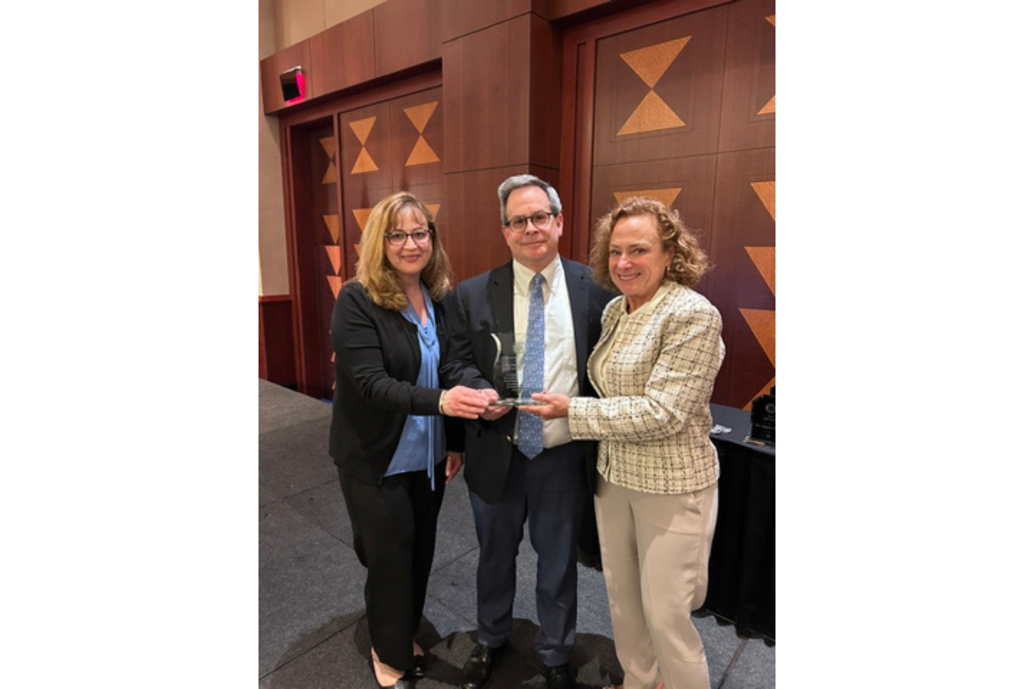 three dentists accept award