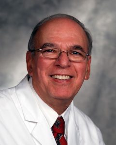 Dr. Harold Moskowitz studio portrait white coat
