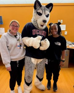 portrait Jonathan the Husky with two nurses